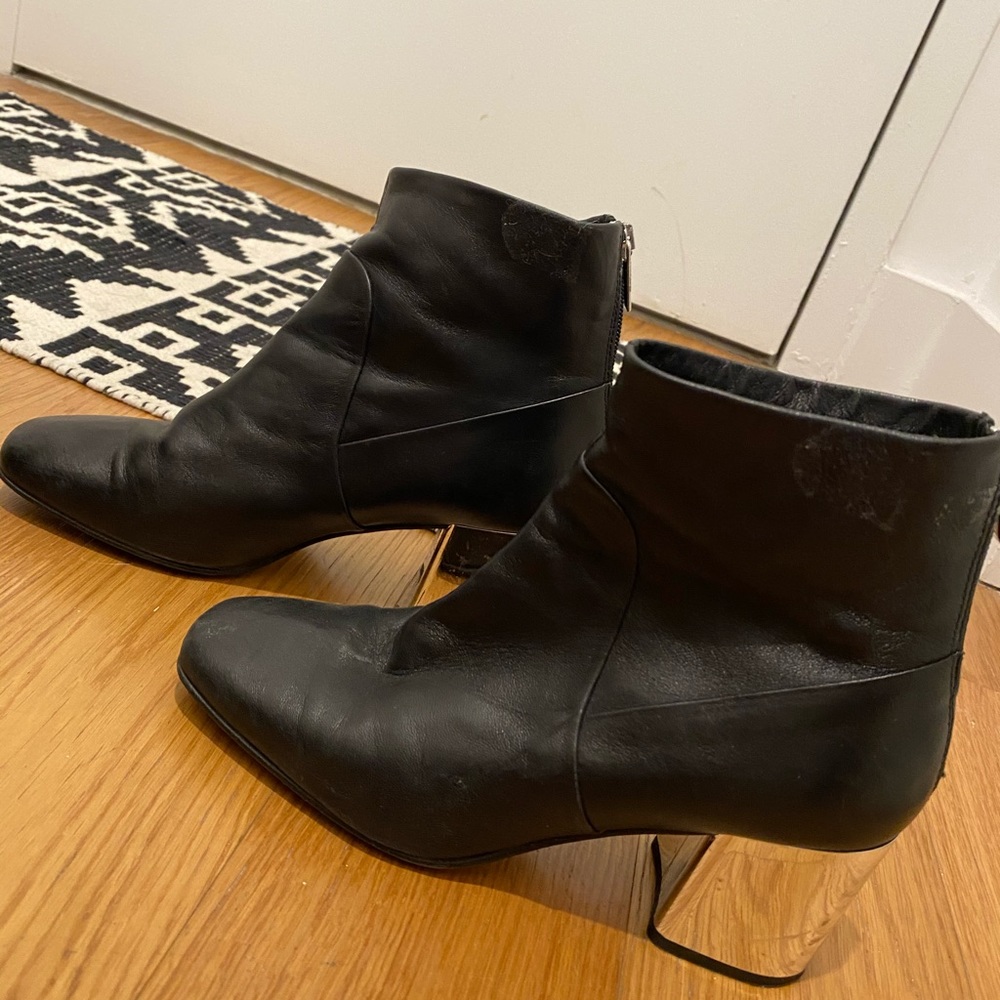 Black Steve Madden booties with mirrored heels